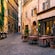 A traditional Italian cafe alongside an alley in Rome